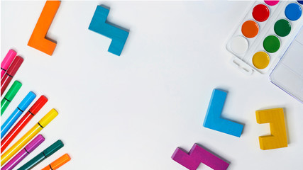 felt-tip pens, cubes, paints and plasticine on a white background. children's desktop. School,...