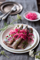 Pickled or Marinated Herring Fillets with Spices and Quick Pickled Onion