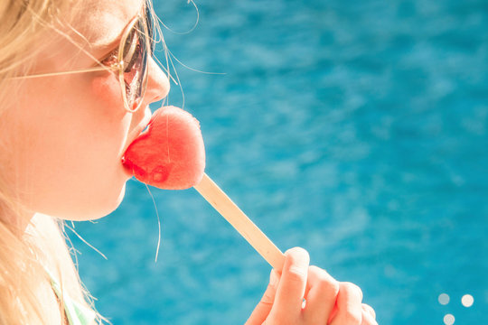 Pretty little girl in swimming pool, summer vacations.