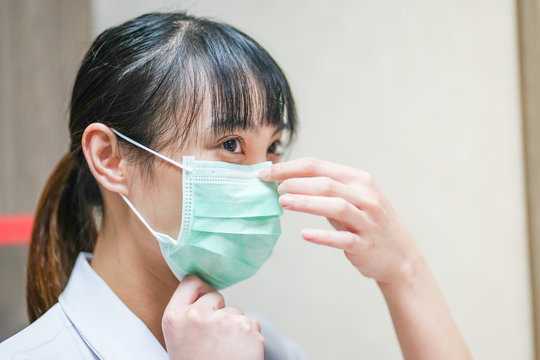 Close Up Asian Female Physician Wearing Medical Mask