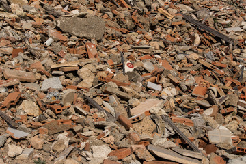 tip, rubble of tiles in house demolition, broken of roof tiles and bricks fragments, construction and architecture