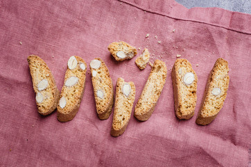 Italian tuscan traditional cookies cantuccini with desert wine in glass.