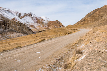the gravel road on the snow mountain