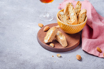 Italian tuscan traditional cookies cantuccini with desert wine in glass.