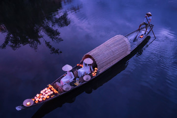 Hue, Vietnam - July 27, 2019 : Lighting candles on the river