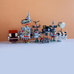 A team of robots make a film. Backstage TV production filmmaking studio with director cameraman and...