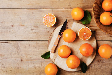 fresh oranges on wooden table