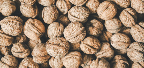 Walnuts background. Nuts texture. Healthy energy vegan food. Superfood for hipster lifestyle.