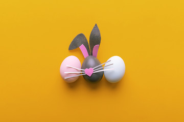 Cute creative photo with easter eggs, some eggs like easter bunny