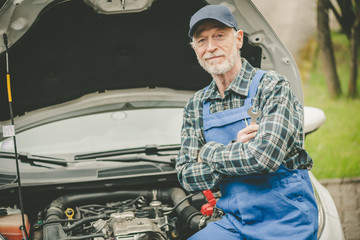 Portrait of car mechanic with arm crossed