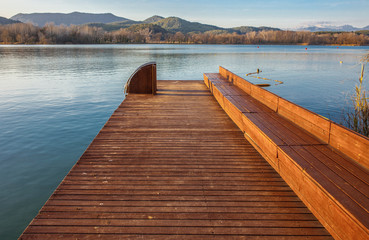 Fototapeta premium Pier with swimming pool ladder at Lake of Banyoles, Catalonia, Spain