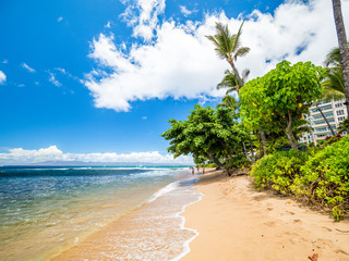 Looking of Kaanapali Beach, Maui, Hawaii. With three miles of white sand and crystal clear water,...