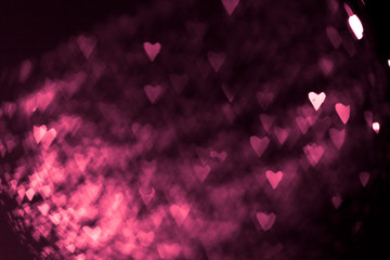 pink or red abstract background with hearts bokeh