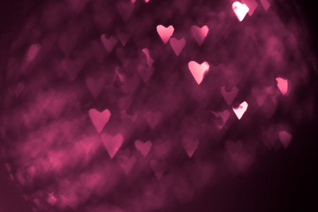 pink or red abstract background with hearts bokeh