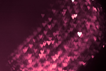 pink or red abstract background with hearts bokeh
