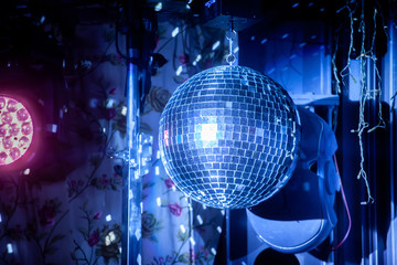 Fototapeta premium Mirror ball for disco with highlights and color lighting, disco.