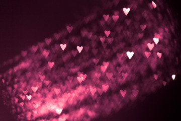 pink or red abstract background with hearts bokeh