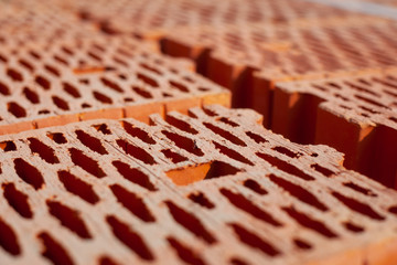 Textured red building brick close-up