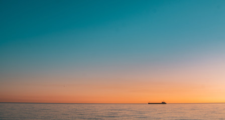 Sea horizon line and sunset photo.