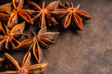 Dried anise stars on the rustic background. Selective focus. Shallow depth of field.