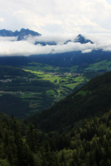 Fototapeta premium White clouds over the valley