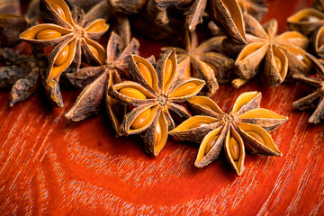 Dried anise stars on the rustic background. Selective focus. Shallow depth of field.