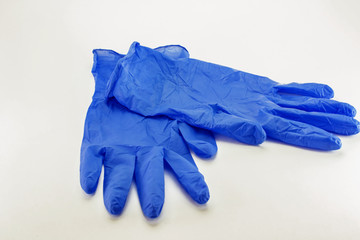 blue medical gloves on a white isolated background
