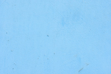 Cement painted wall background, baby-blue pastel color texture