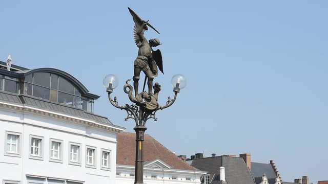 Lamppost showing Archangel Michael at the Saint Michael's bridge in Ghent, Belgium