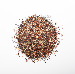 Mixture of red, black and white quinoa seeds isolated