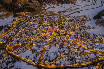 San Candido Innichen by night in South Tyrol Alto Adige, Italy during winter season. Aerial drone shot in january 2020