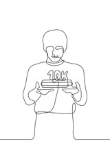 one continuous line drawing a young man holding a cake with a candle in the shape of "10K", which means ten thousand subscribers / followers, a person holding a cake - blogger / video blogger