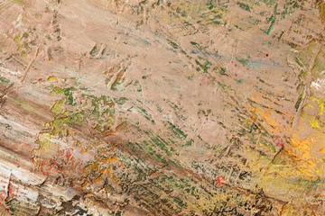 Background image of bright oil-paint palette closeup.