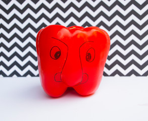 Funny face on red peper. Creative vegetable concept.