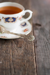 Elegance cup of tea and flowers on wooden table