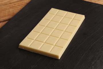 white chocolate tablet in color background