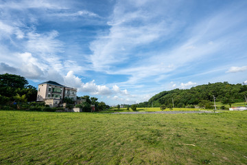 Obraz premium landscape with houses and blue sky