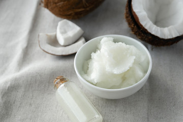 image of coconut oil and fresh coconuts .