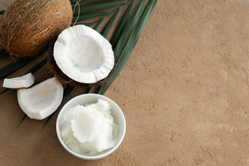 image of coconut oil and fresh coconuts . space for text