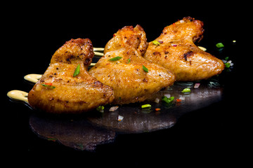 Chicken wings baked at the stake..