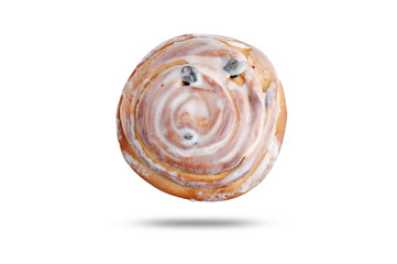  bun with raisins in white glaze. isolated on white background