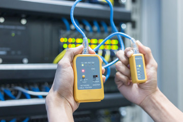 equipment. Tester cable lan in the hands.