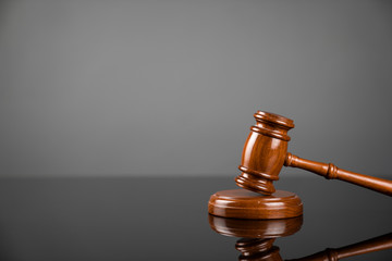 Gavel on gray background. Law, auction and business concept.  