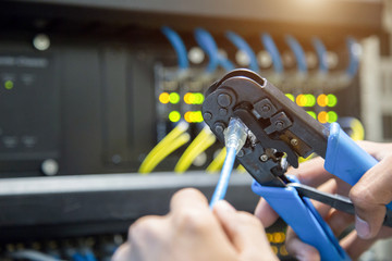 Male hand preparing a Lan Cable.