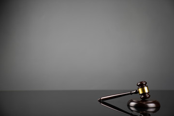Gavel on gray background. Law, auction and business concept.  