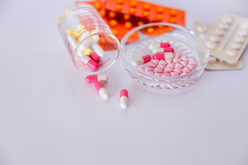 Drug prescription for treatment medication. Pharmaceutical medicament cure in container for health Pharmacy theme, capsule pills with medicine antibiotic in packages..