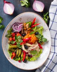 Different pickled vegetables on a plate. Top view.