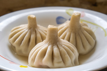 hot delicious khinkali on a beautiful plate