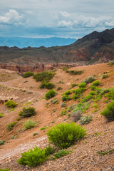 view of the canyon against a cloudy, stormy sky