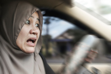 Shocked Female Muslim Driver About To Have Accident